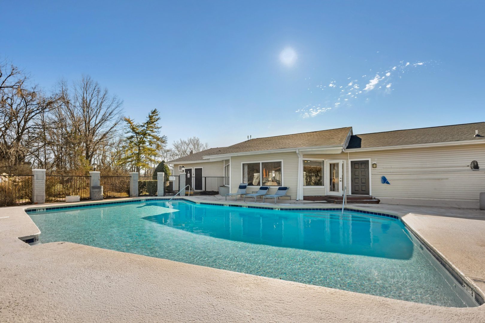 a large pool in front of a house at The  Darby