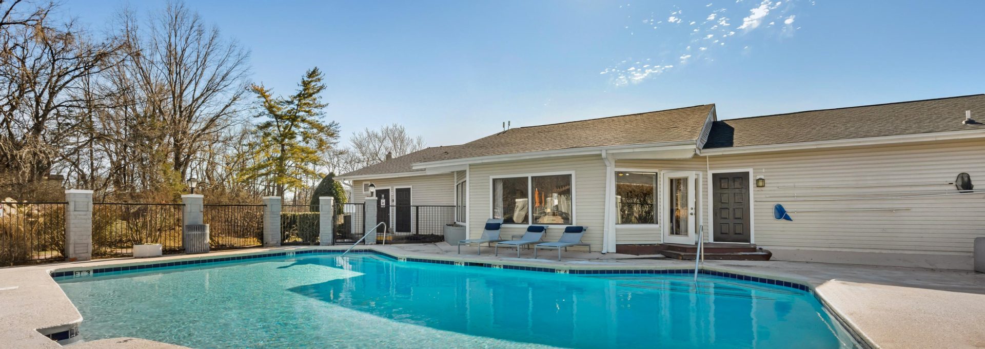 a large pool in front of a house at The  Darby