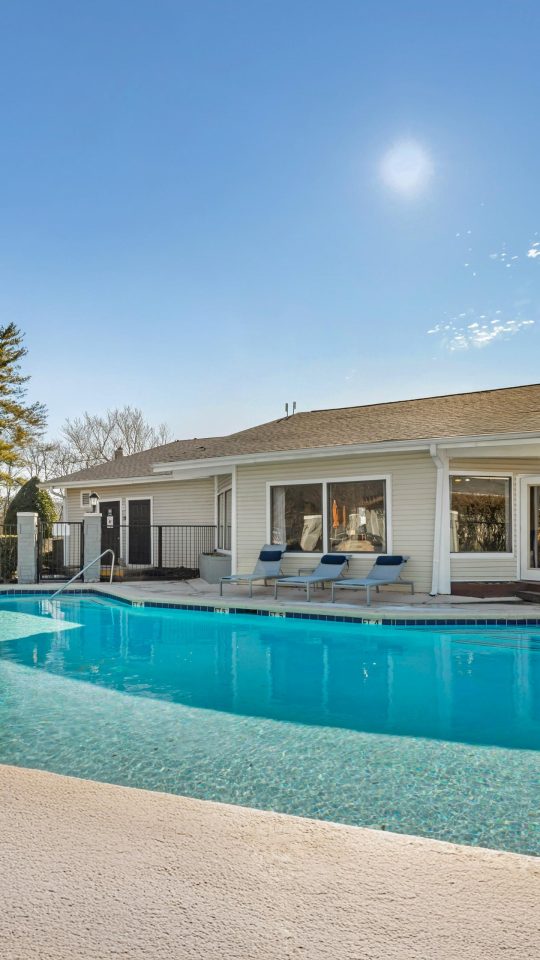 a large pool in front of a house at The  Darby