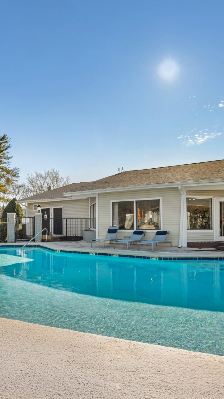 a large pool in front of a house at The  Darby