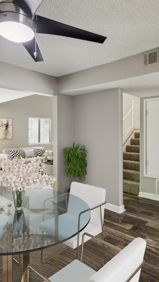 a dining room with a ceiling fan and hardwood floors at The  Darby
