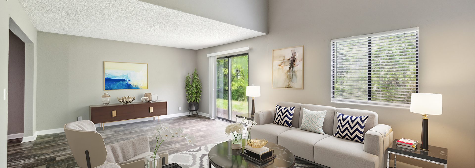 a living room with a large window and a couch at The  Darby